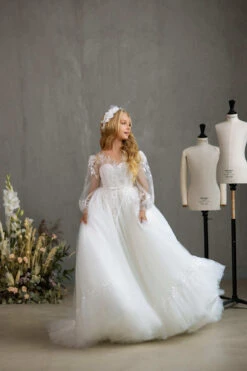 SARNIA – DELICATE COMMUNION DRESS WITH SHEER PUFF SLEEVES AND RUFFLED HEM(Sarnia Delicate Communion Dress With Sheer Puff Sleeves And Ruffled Hem) -Mia Bambina Store mia bambina boutique sarnia delicate communion dress with sheer puff sleeves and ruffled hem 2